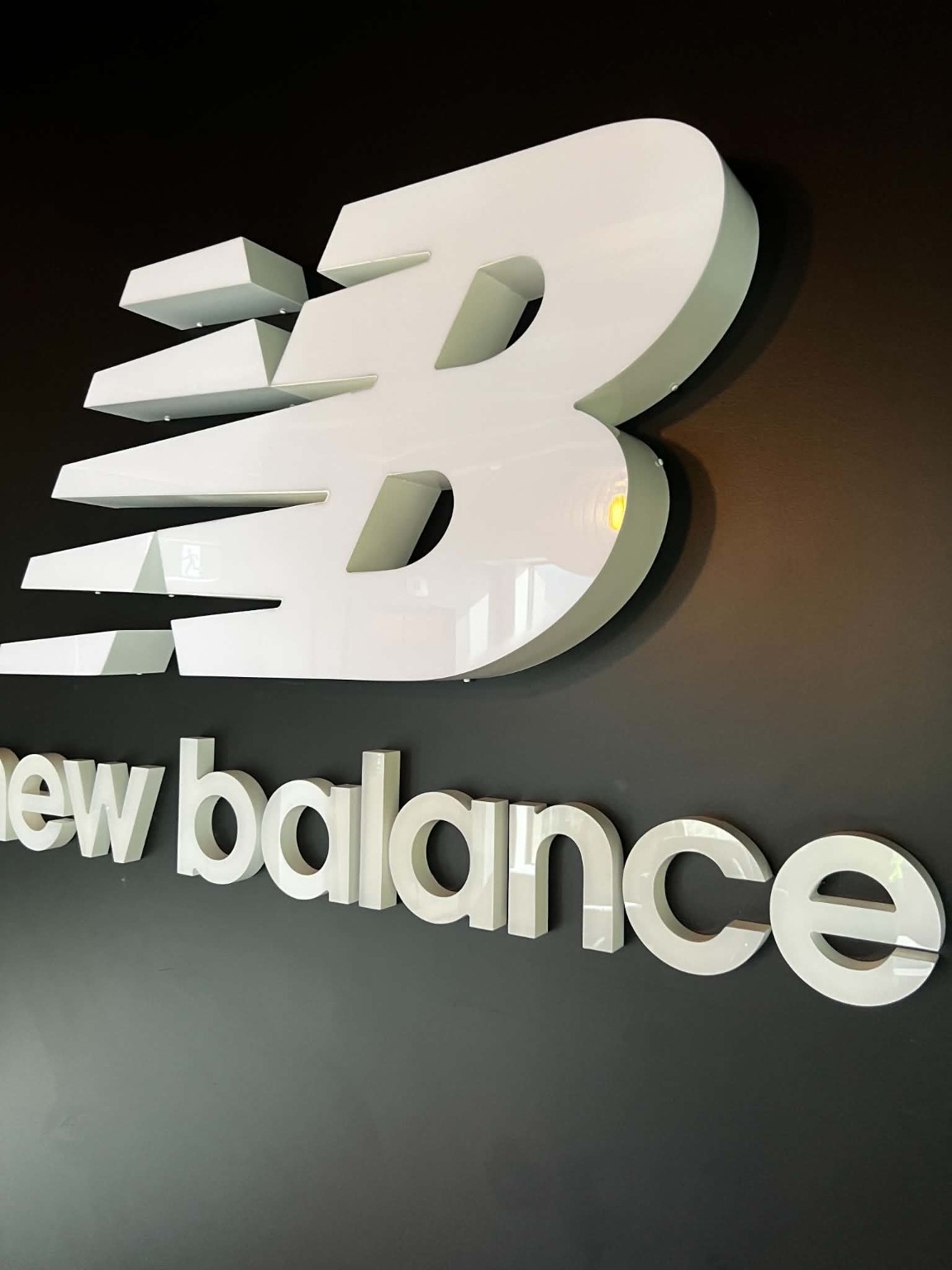 Dimensional white wall logo and lettering