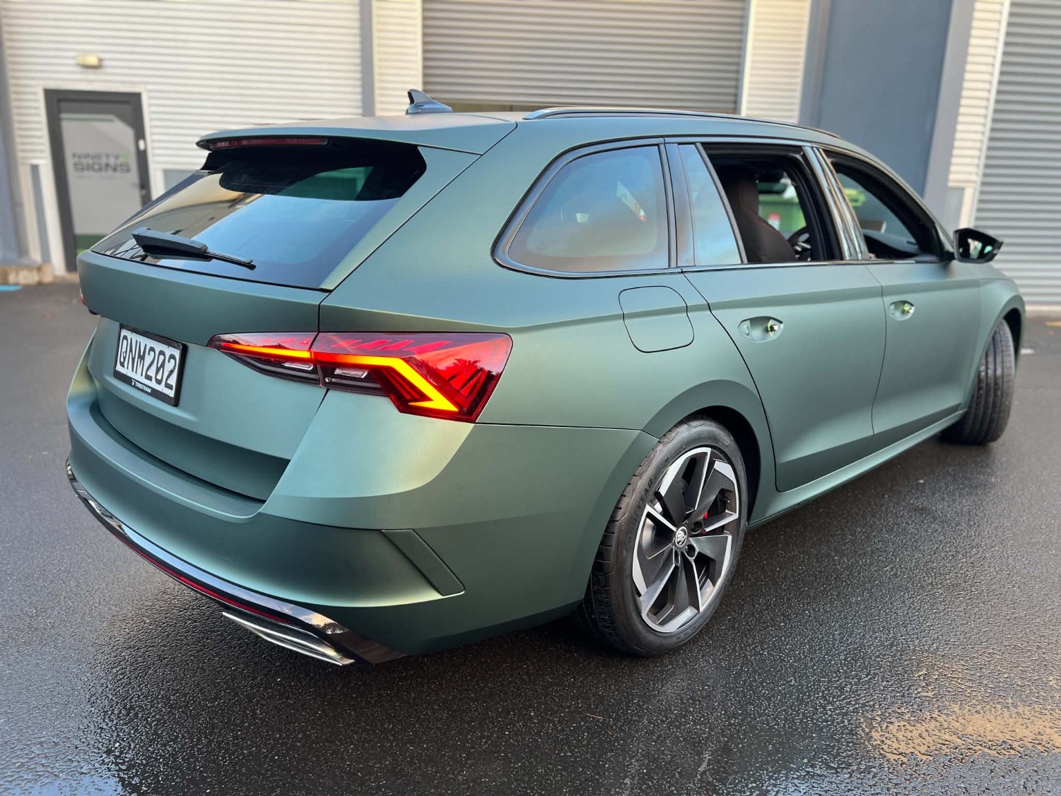 Custom vehicle graphics on a green wagon