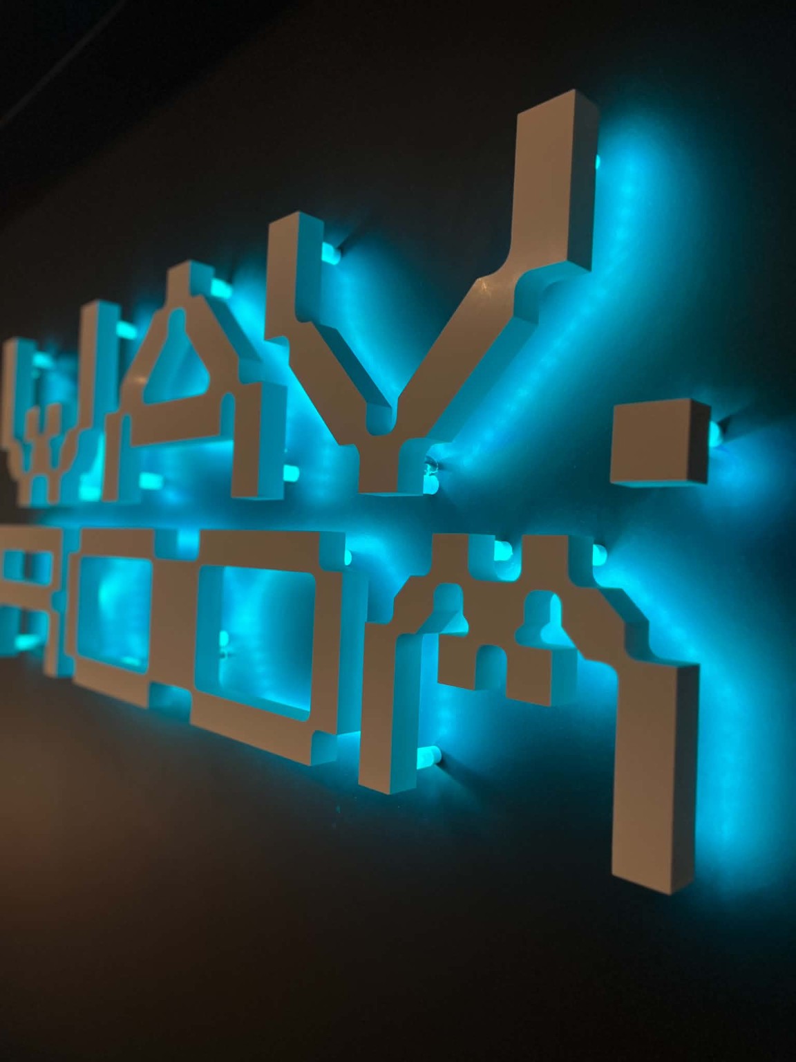 Illuminated dimensional cyan signage
